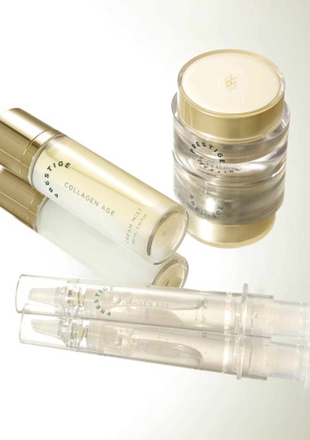 Skincare products including a jar, two bottles, and two small containers on a white background.